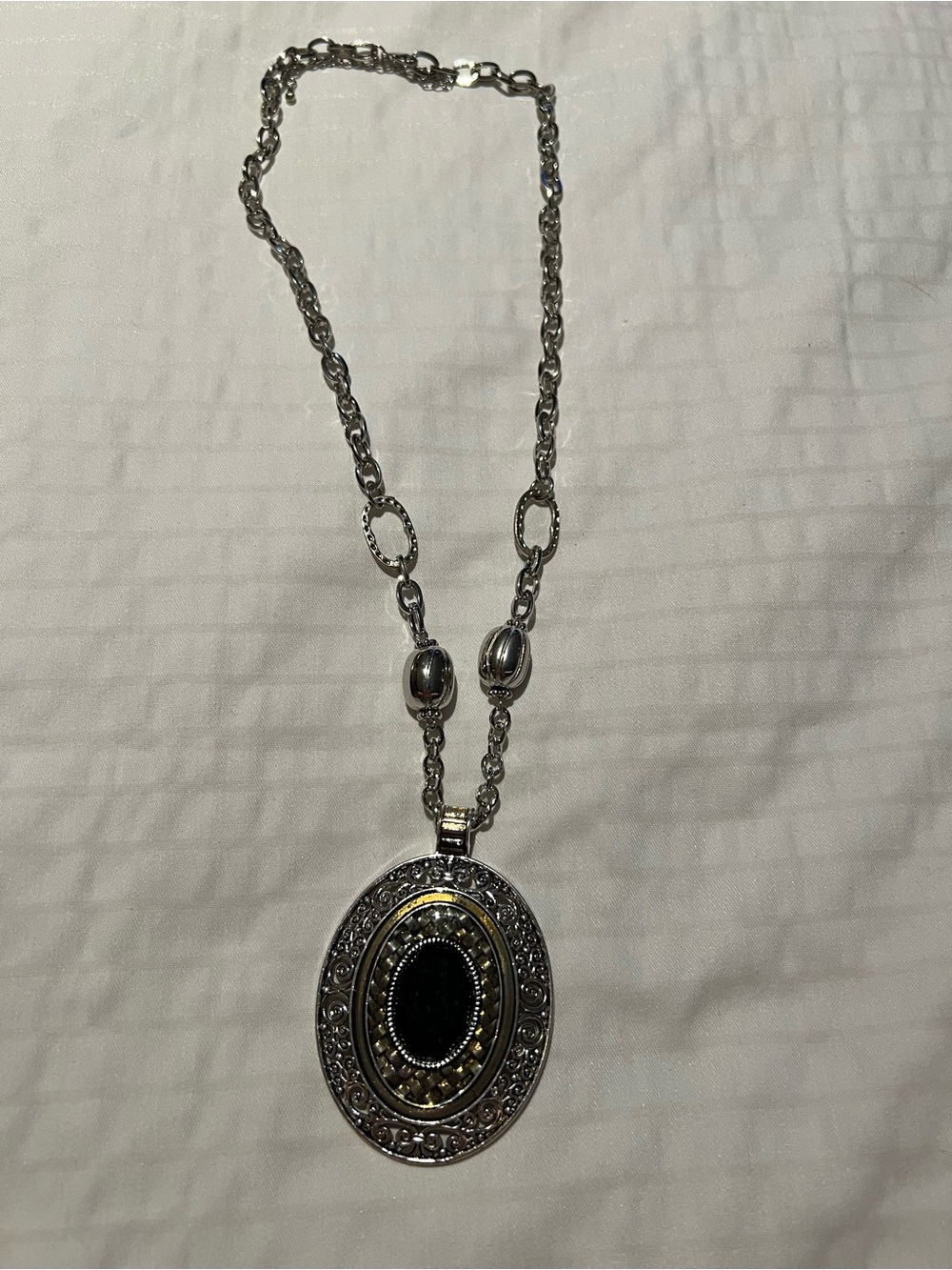 Silver-Tone Oval Pendant Necklace with Black Center